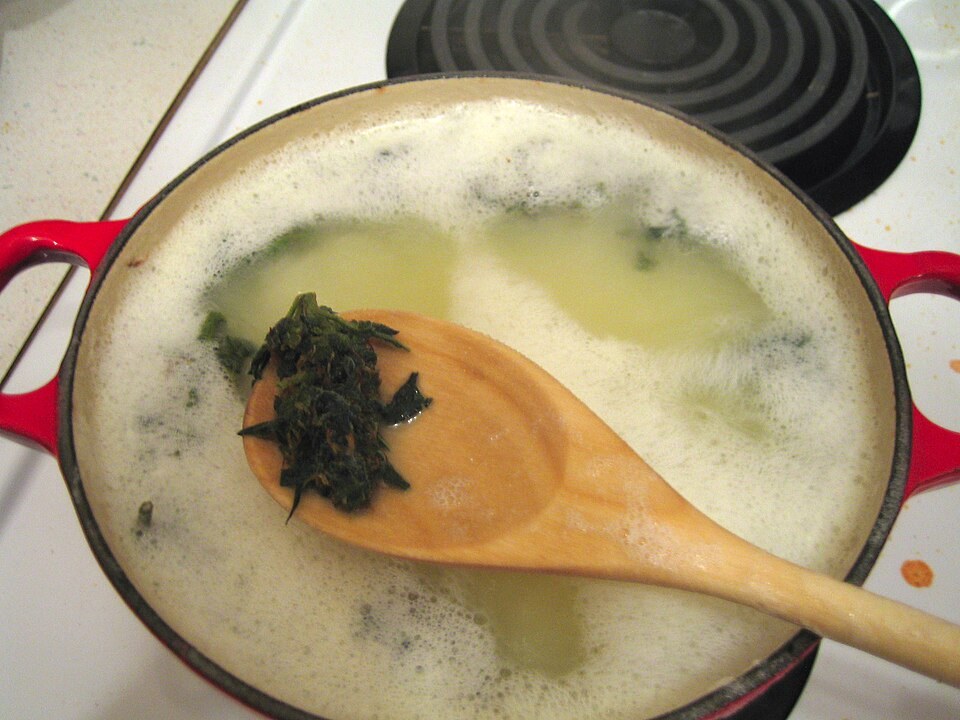 Cannabis simmering in melted butter